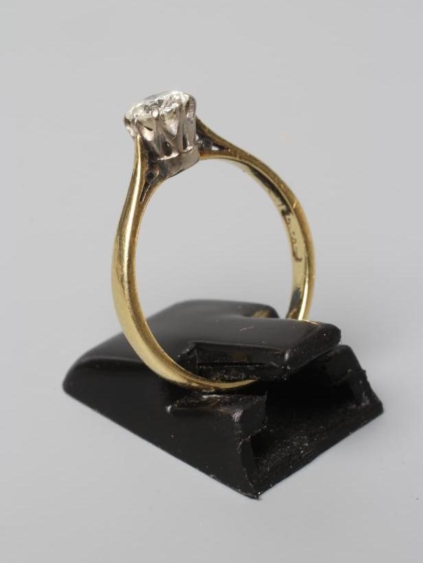 A SOLITAIRE DIAMOND RING, the round brilliant cut stone of approximately 0.60cts, claw set to a Image