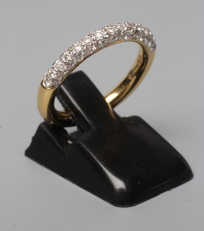 A THREE ROW DIAMOND HALF HOOP ETERNITY RING, stamped 750, 18k, size K (Est. plus 24% premium inc. Image