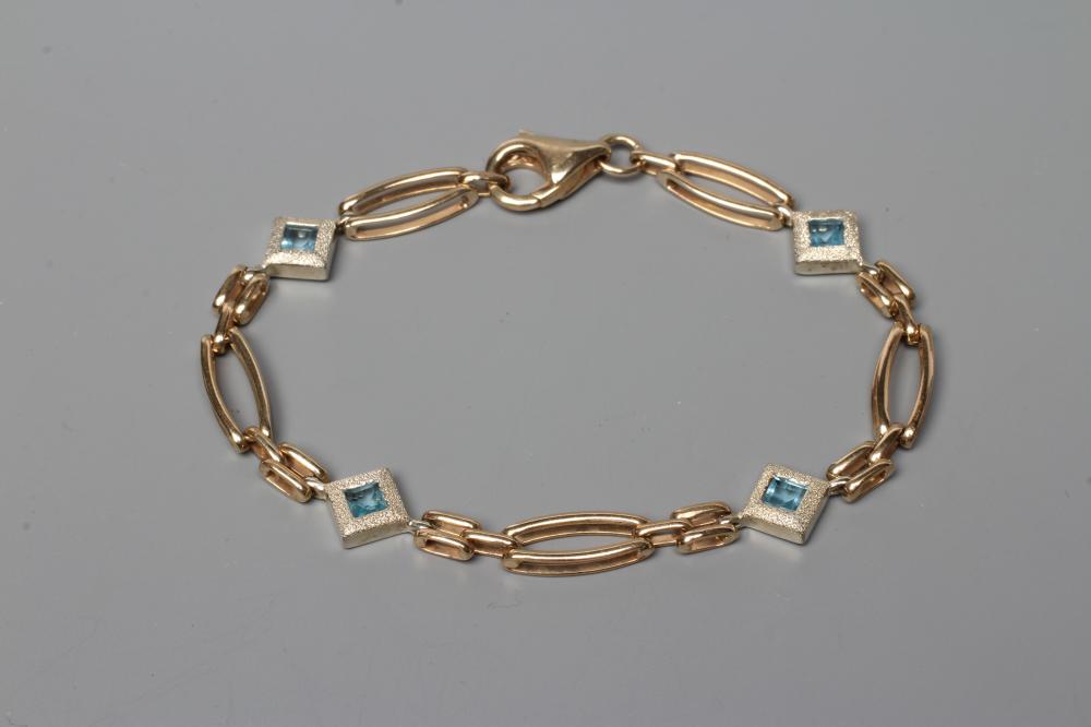 A 9CT GOLD BRACELET, the elongated oval links with four square spacers between set with a square cut Image