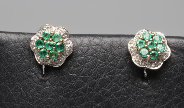 A PAIR OF EMERALD AND DIAMOND CLUSTER EAR STUDS, the central seven stone emerald clusters within a Image
