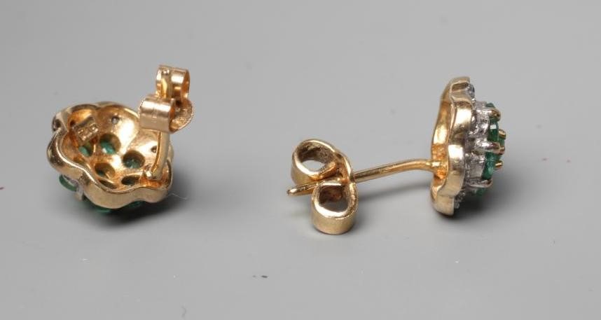 A PAIR OF EMERALD AND DIAMOND CLUSTER EAR STUDS, the central seven stone emerald clusters within a Image