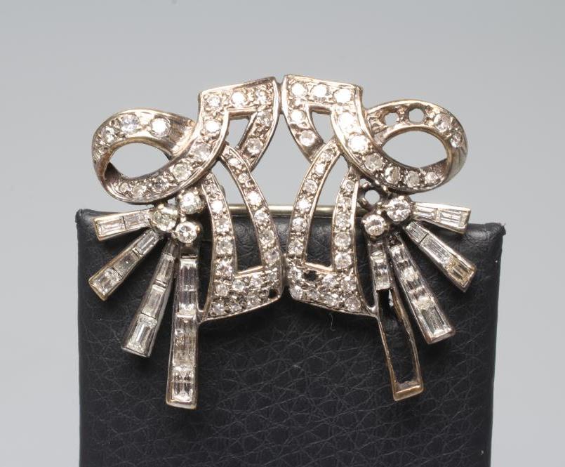 A LATE VICTORIAN DOUBLE BOW BROOCH with loops and tails pave set with numerous small stones and Image
