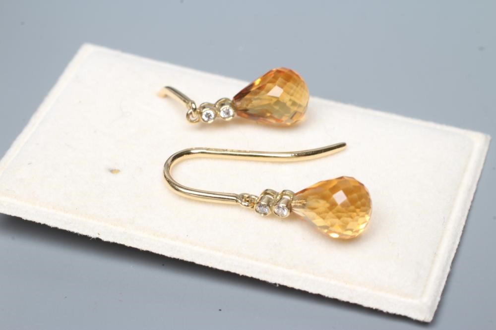 A PAIR OF CITRINE DROP EARRINGS, the briolette cut stones peg set to two diamond points on 18ct gold Image