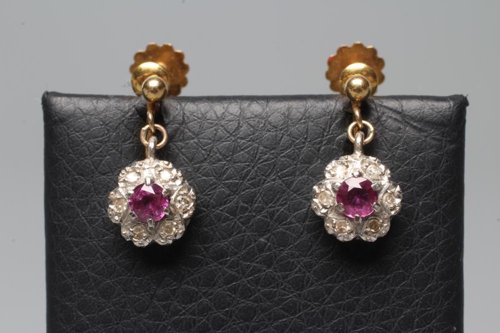 A PAIR OF EDWARDIAN RUBY AND DIAMOND CLUSTER EARRINGS on screw back fittings stamped 9ct (Est. plus Image