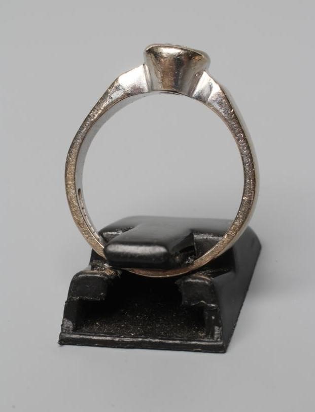 A SOLITAIRE DIAMOND RING, the brilliant cut stone of approximately 0.30cts in rub-over setting to a Image