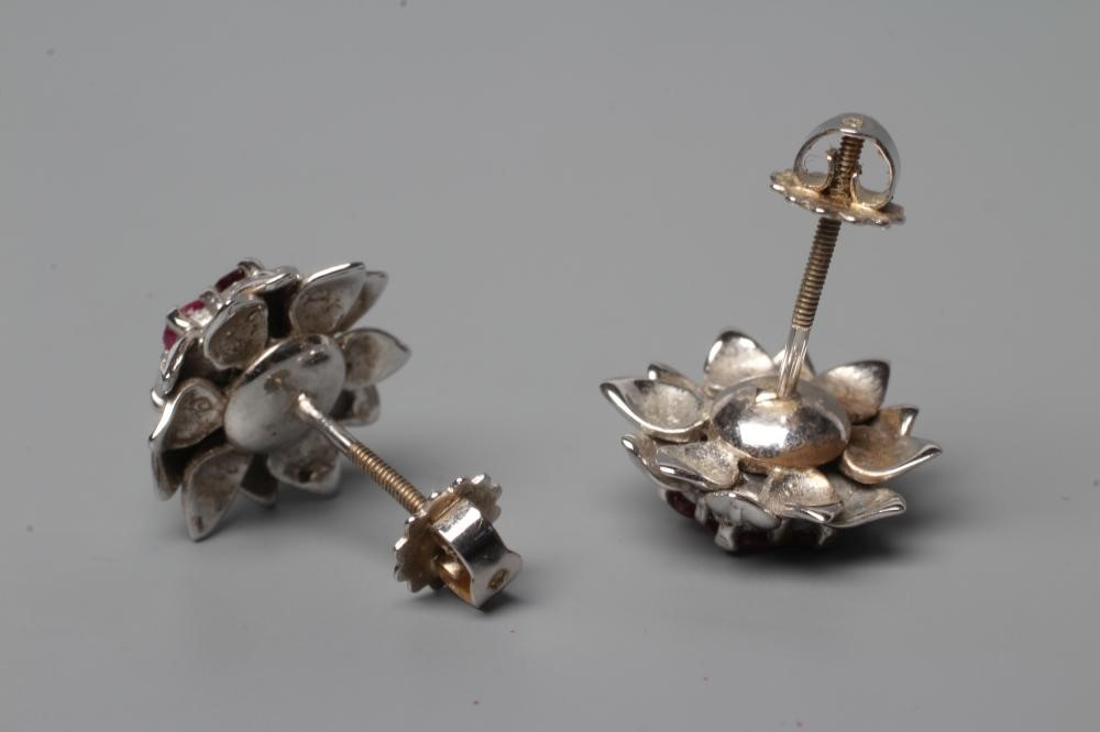 A PAIR OF RUBY AND DIAMOND CLUSTER EAR STUDS Image