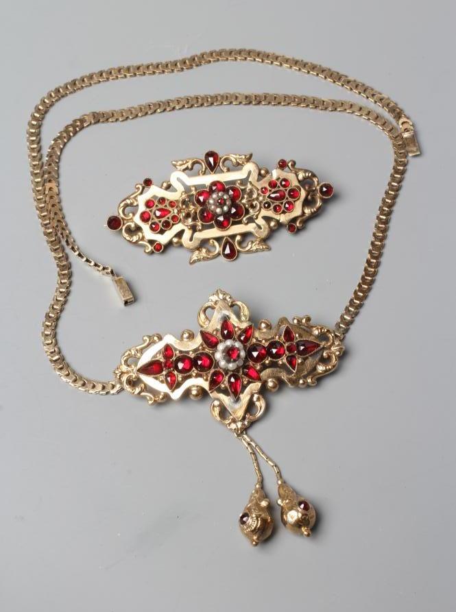 A MID 19TH CENTURY GARNET AND SEED PEARL OPEN BROOCH similar to the previous lot Image