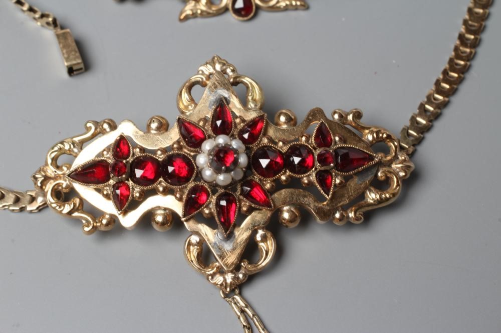 A MID 19TH CENTURY GARNET AND SEED PEARL OPEN BROOCH similar to the previous lot Image