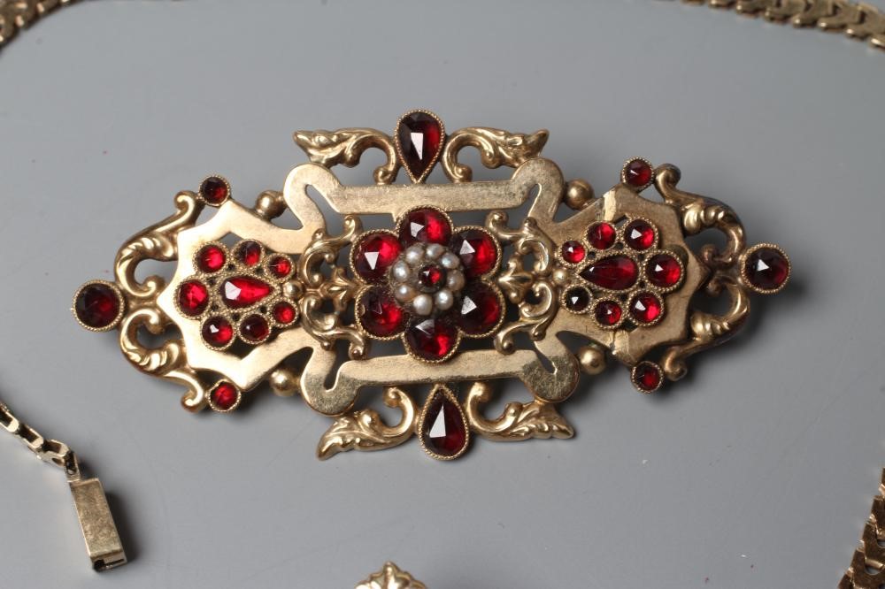 A MID 19TH CENTURY GARNET AND SEED PEARL OPEN BROOCH similar to the previous lot Image