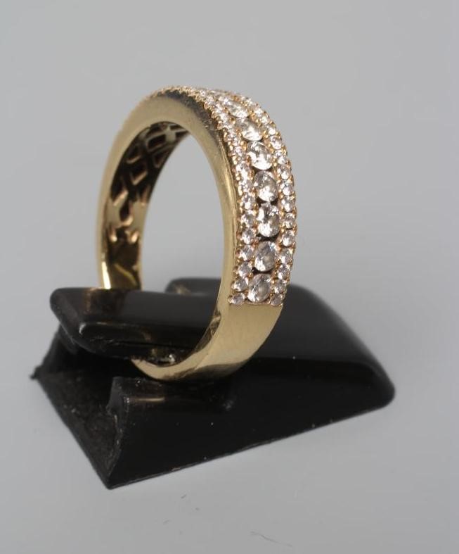 A DIAMOND HALF HOOP ETERNITY RING Image