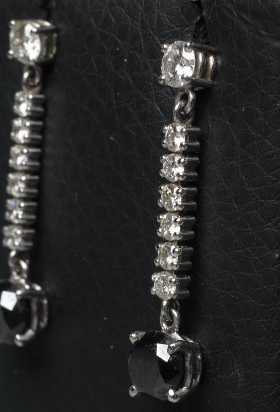 A PAIR OF DIAMOND DROP EARRINGS Image