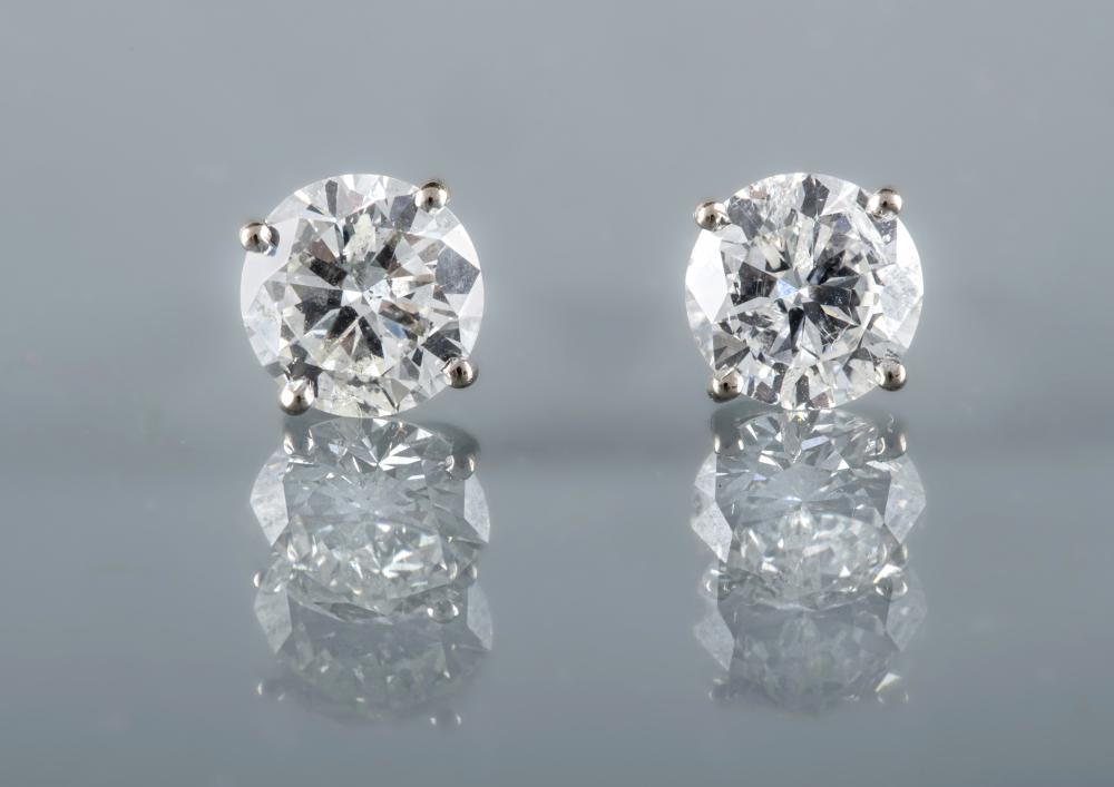 A PAIR OF DIAMOND SOLITAIRE EAR STUDS Image
