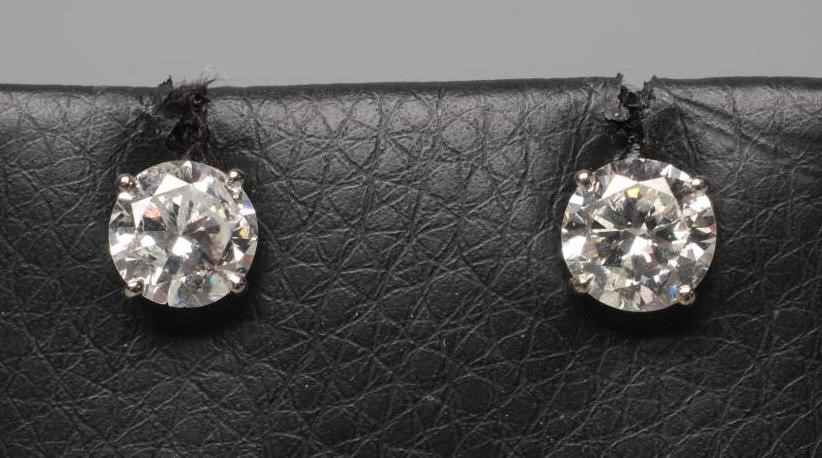 A PAIR OF DIAMOND SOLITAIRE EAR STUDS Image