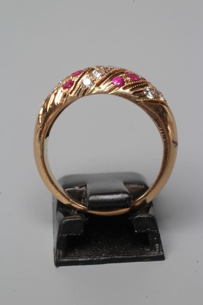 A RUBY AND DIAMOND BAND RING set with alternating wrythen bands on a plain shank, stamped 18c, size Image