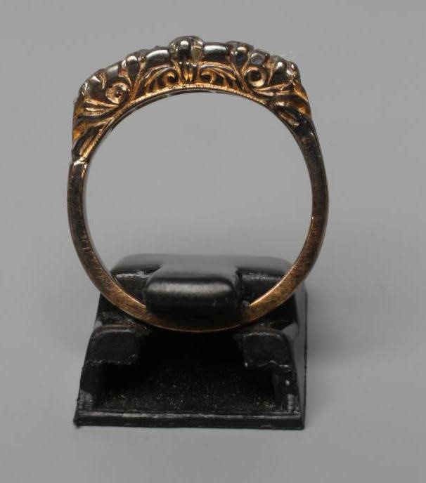 A FIVE STONE DIAMOND RING, the graduated mix cut stones point set to a plain shank stamped 18ct, Image