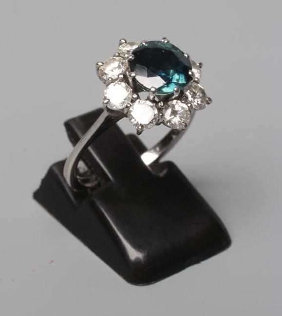 A SAPPHIRE AND DIAMOND CLUSTER RING Image