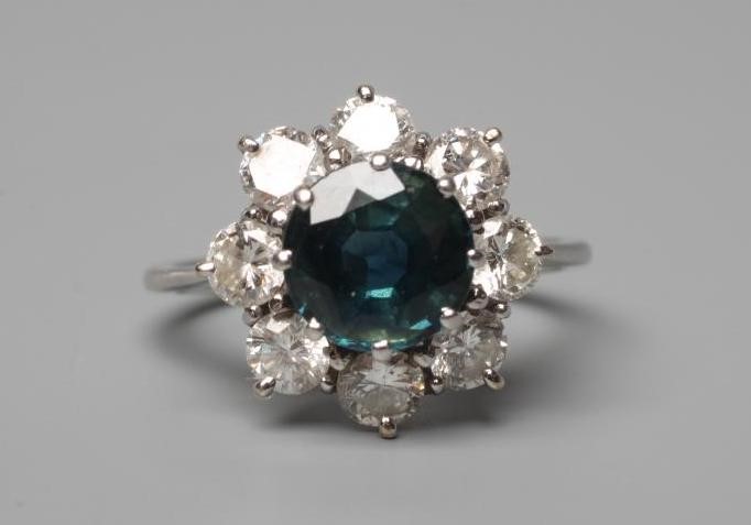A SAPPHIRE AND DIAMOND CLUSTER RING Image