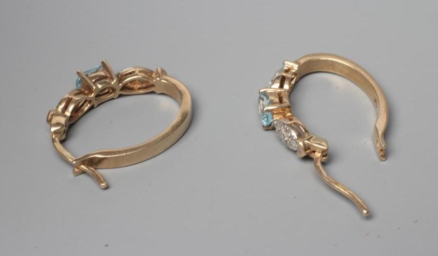 A PAIR OF BLUE TOPAZ AND DIAMOND HOOP EARRINGS, the oval topaz claw set between two panels of pave Image