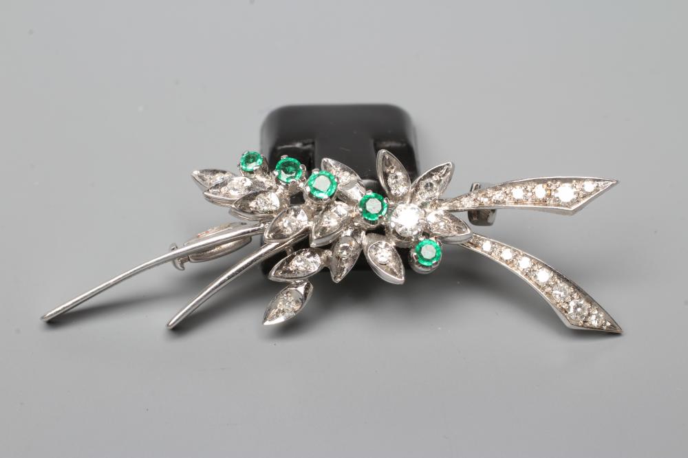 AN EMERALD AND DIAMOND SPRAY BROOCH claw set with five small emeralds and numerous graduated Image
