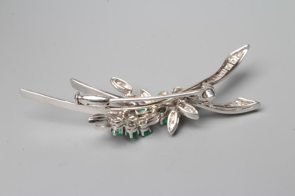 AN EMERALD AND DIAMOND SPRAY BROOCH claw set with five small emeralds and numerous graduated Image