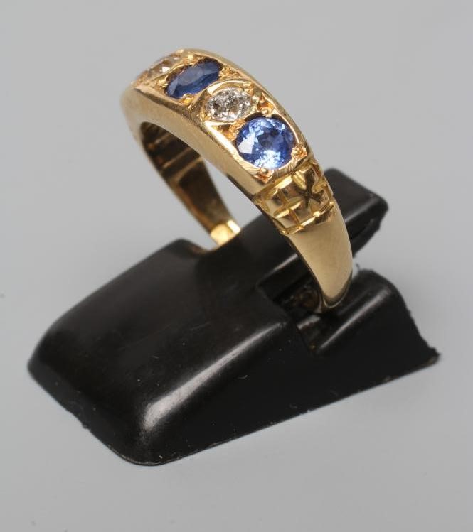 A LATE VICTORIAN SAPPHIRE AND DIAMOND HALF HOOP RING Image