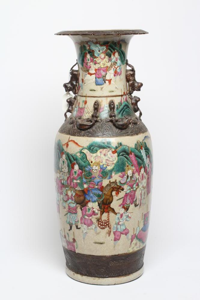 A CHINESE ALCOVE VASE of rouleau form with shi-shi handles and applied salamanders to the shoulders Image