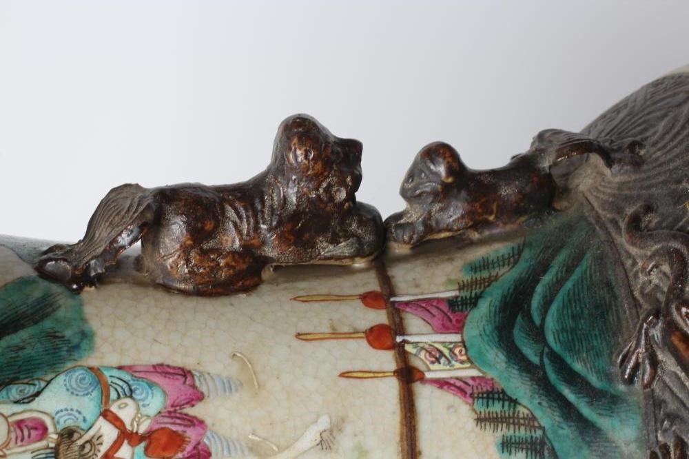 A CHINESE ALCOVE VASE of rouleau form with shi-shi handles and applied salamanders to the shoulders Image
