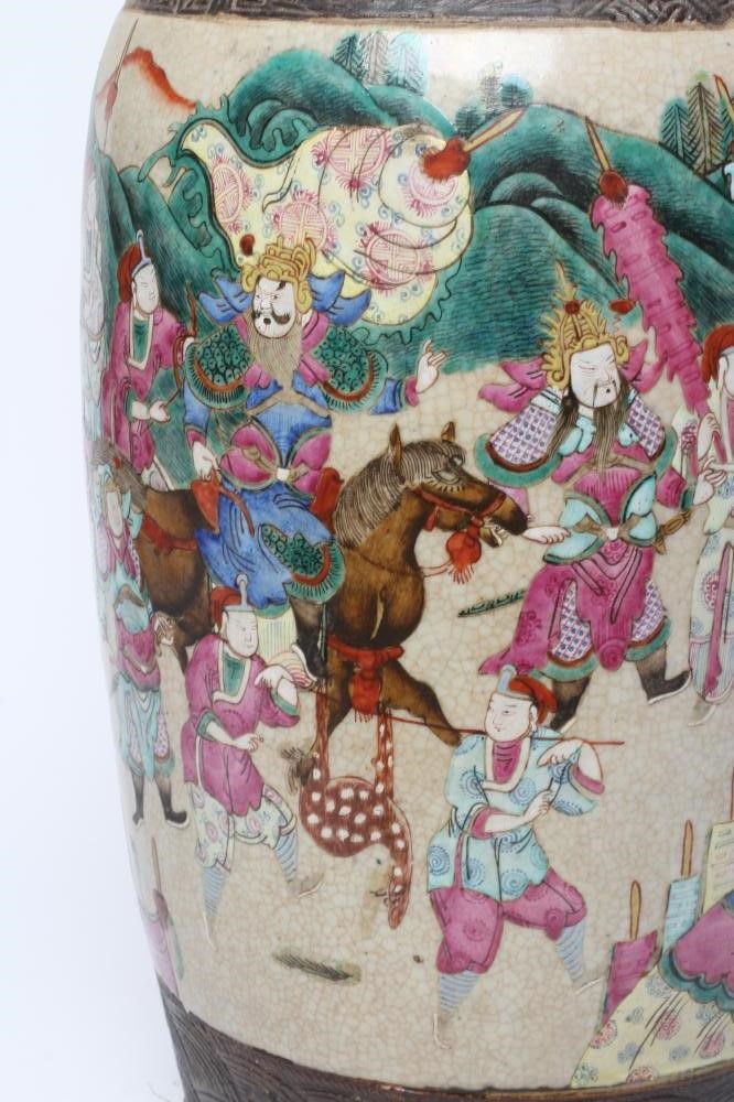 A CHINESE ALCOVE VASE of rouleau form with shi-shi handles and applied salamanders to the shoulders Image