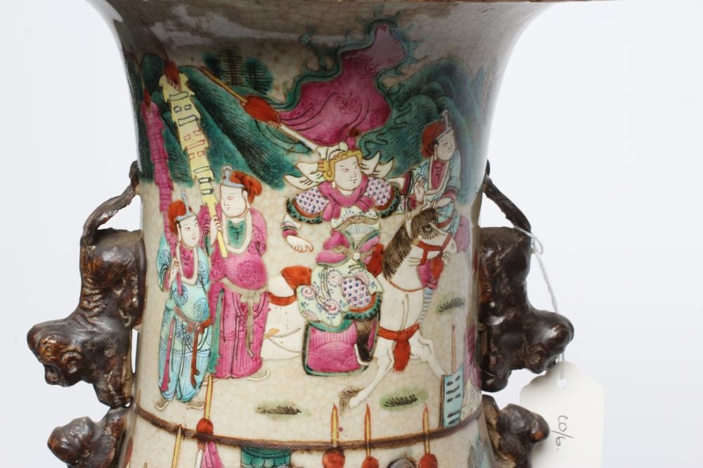 A CHINESE ALCOVE VASE of rouleau form with shi-shi handles and applied salamanders to the shoulders Image