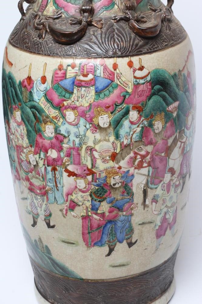 A CHINESE ALCOVE VASE of rouleau form with shi-shi handles and applied salamanders to the shoulders Image