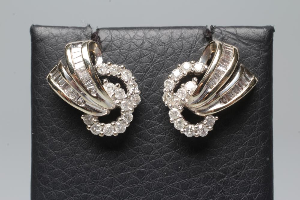 A PAIR OF DIAMOND STUD EARRINGS Image