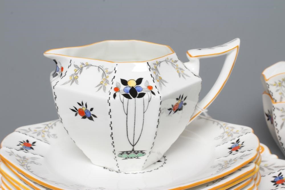 AN ART DECO SHELLEY CHINA QUEEN ANNE TEA SERVICE printed and overpainted with the "Red Daisy" Image