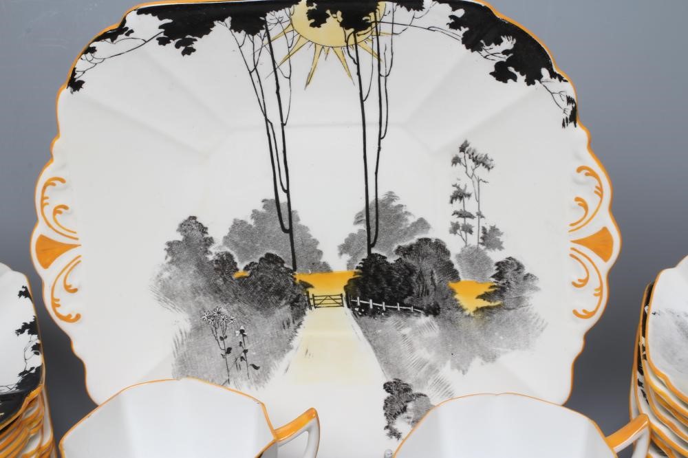AN ART DECO SHELLEY CHINA QUEEN ANNE TEA SERVICE printed and overpainted with the Tall Trees at Image