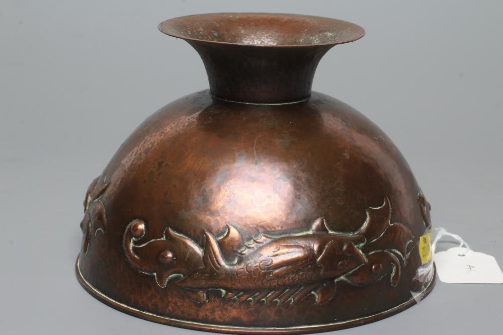 A NEWLYN COPPER PEDESTAL BOWL, early 20th century, hammered with a band of three scaly fish on a Image
