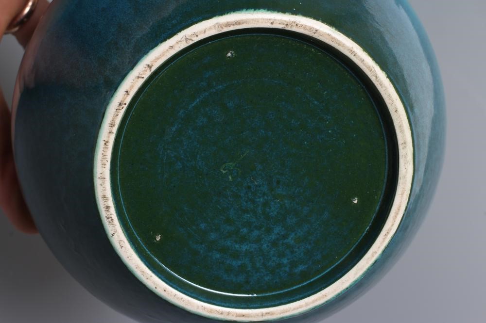 A RUSKIN VASE, early 20th century, of globular form with garlic type neck, the streaky blue souffle Image