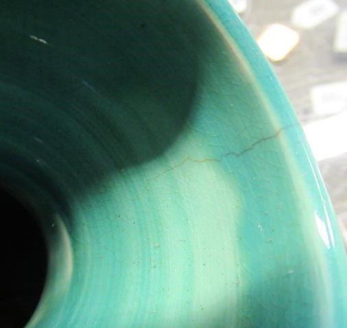 A RUSKIN VASE, early 20th century, of globular form with garlic type neck, the streaky blue souffle Image