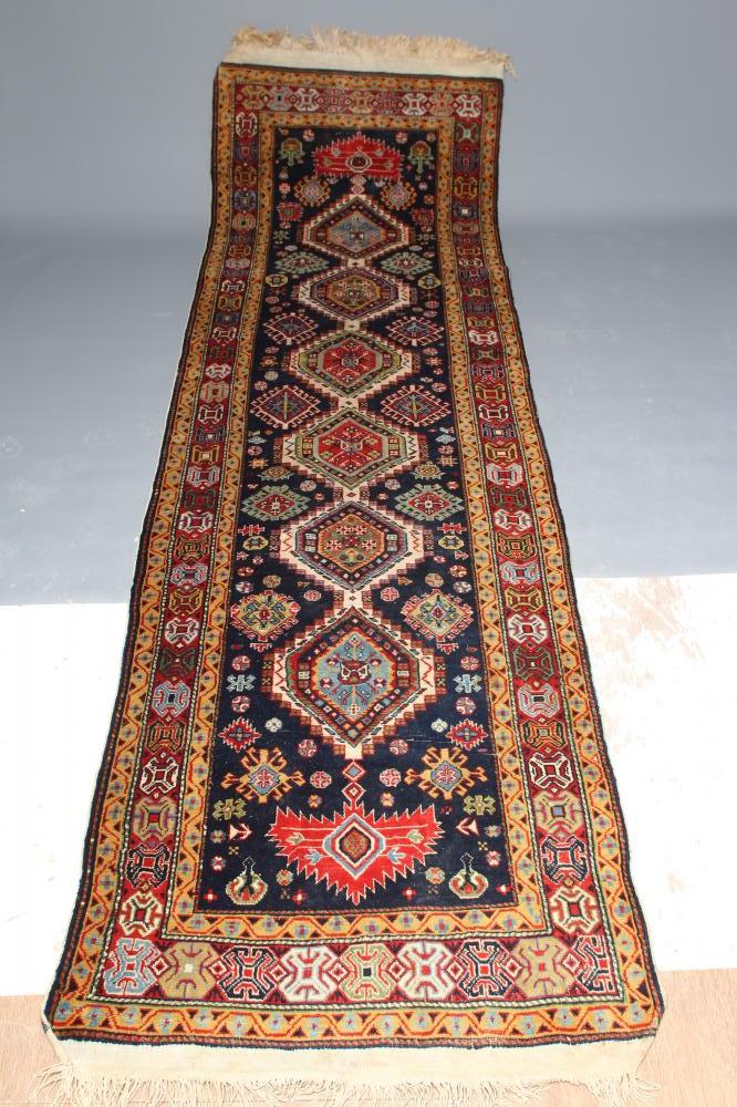 A PERSIAN TRIBAL RUG Image