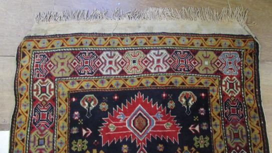A PERSIAN TRIBAL RUG Image