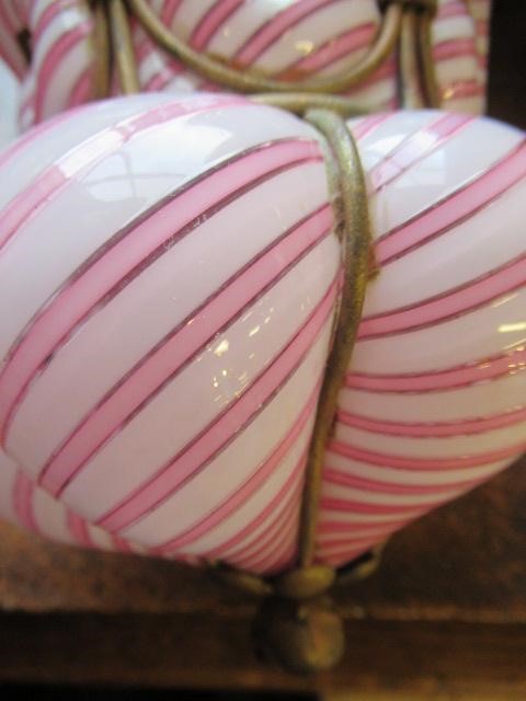 A VICTORIAN HANGING LANTERN, the wirework frame with a custom blown pink and white candy stripe Image