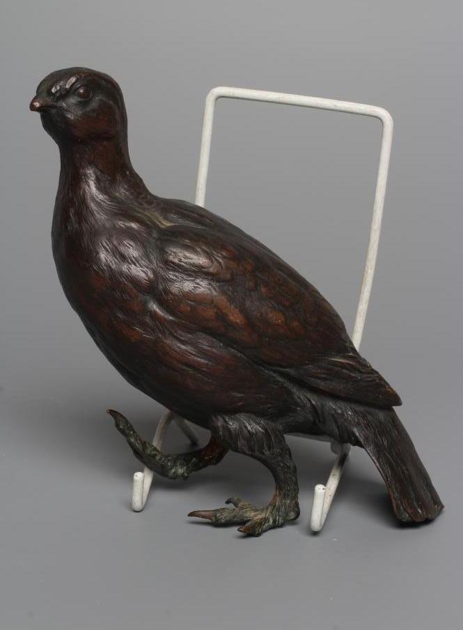A FRANZ BERGMAN CAST BRONZE GROUSE, numbered 7508, factory mark and Geschutz, 7 1/2" long (Est. plus Image