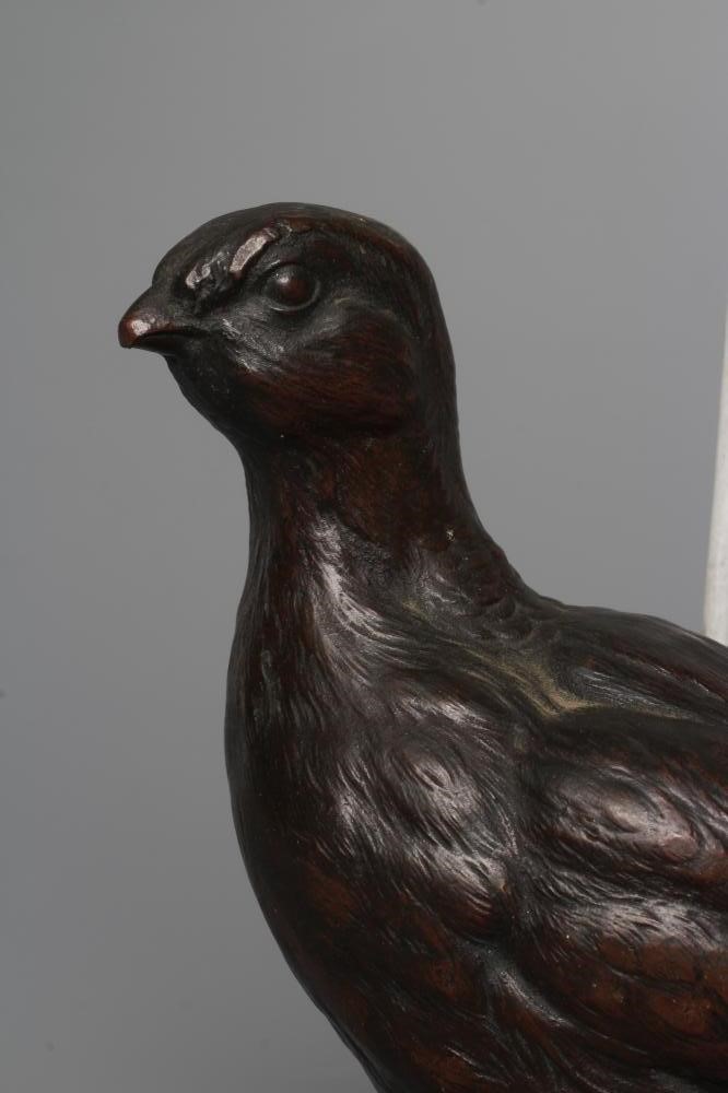 A FRANZ BERGMAN CAST BRONZE GROUSE, numbered 7508, factory mark and Geschutz, 7 1/2" long (Est. plus Image