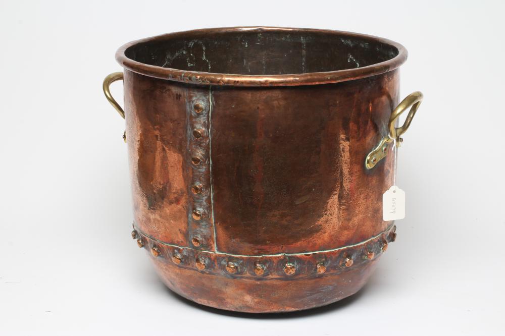 A COPPER LOG BIN, early 20th century, of cylindrical form with moulded rim, riveted seams and brass Image