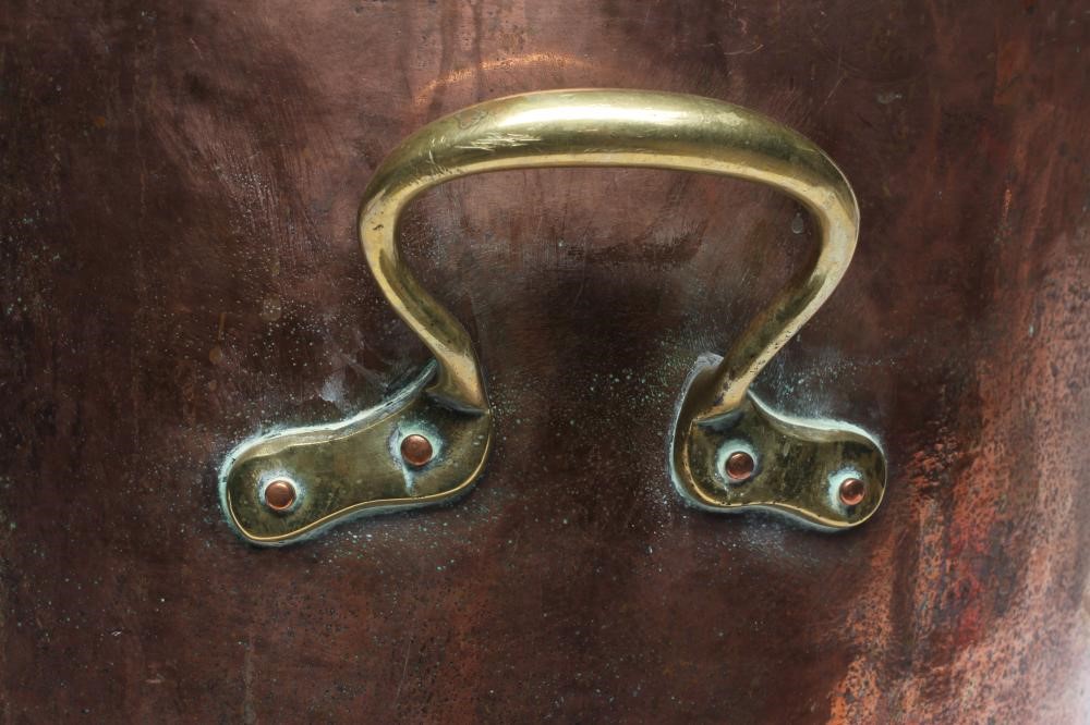 A COPPER LOG BIN, early 20th century, of cylindrical form with moulded rim, riveted seams and brass Image