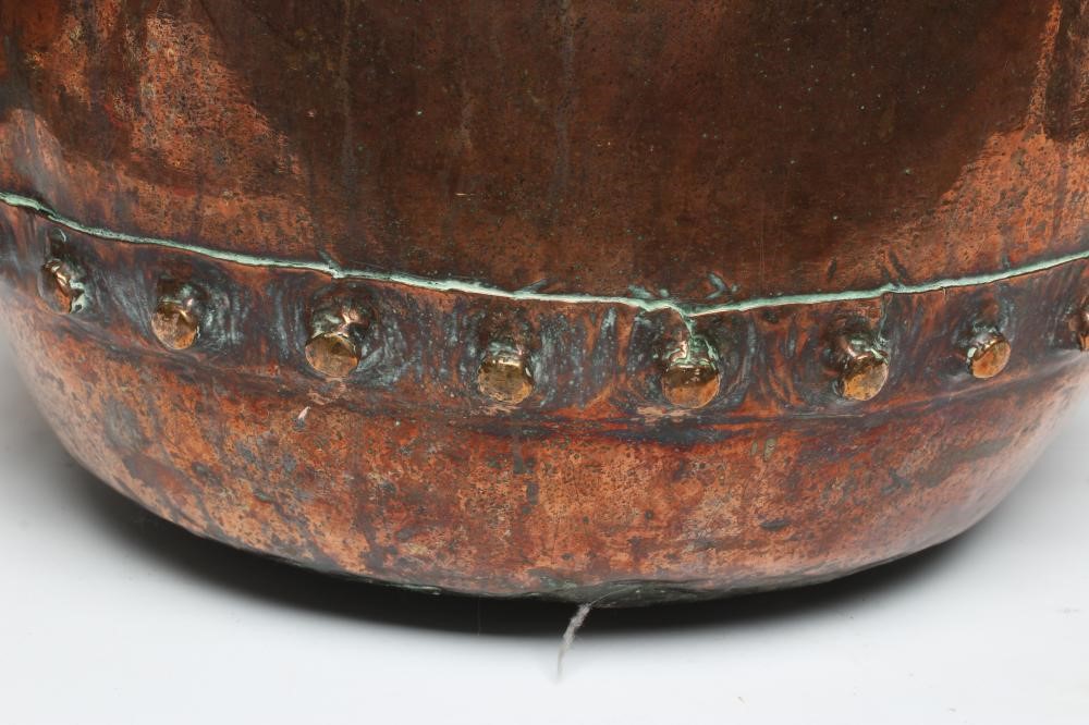 A COPPER LOG BIN, early 20th century, of cylindrical form with moulded rim, riveted seams and brass Image
