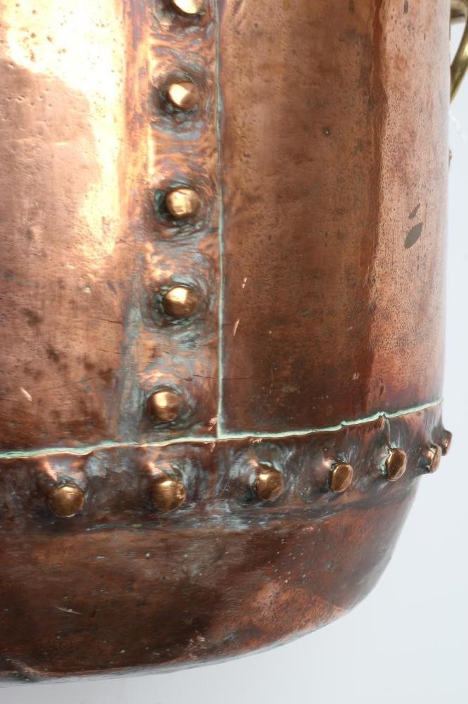 A COPPER LOG BIN, early 20th century, of cylindrical form with moulded rim, riveted seams and brass Image