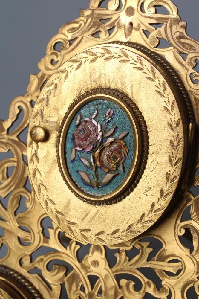 A LATE VICTORIAN GILT METAL TRIPLE PHOTOGRAPH FRAME of triangular section Image