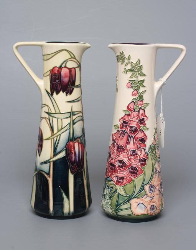 TWO MOORCROFT POTTERY PRETTY PENNY AND FOXGLOVE EWERS of tapering cylindrical form Image