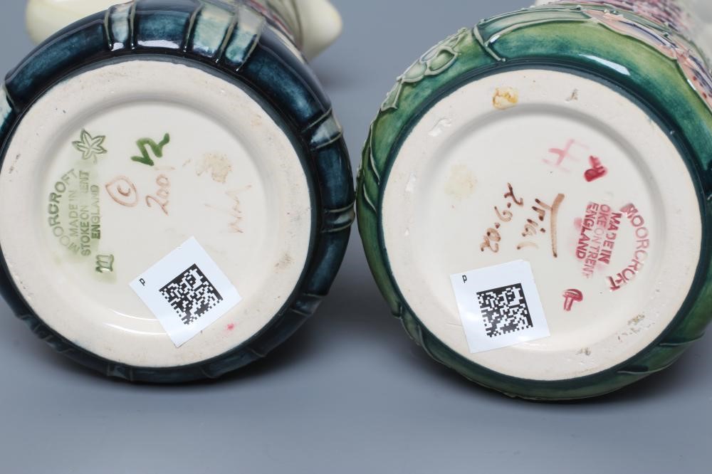 TWO MOORCROFT POTTERY PRETTY PENNY AND FOXGLOVE EWERS of tapering cylindrical form Image