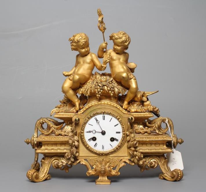 A FRENCH ORMOLU MANTEL CLOCK Image