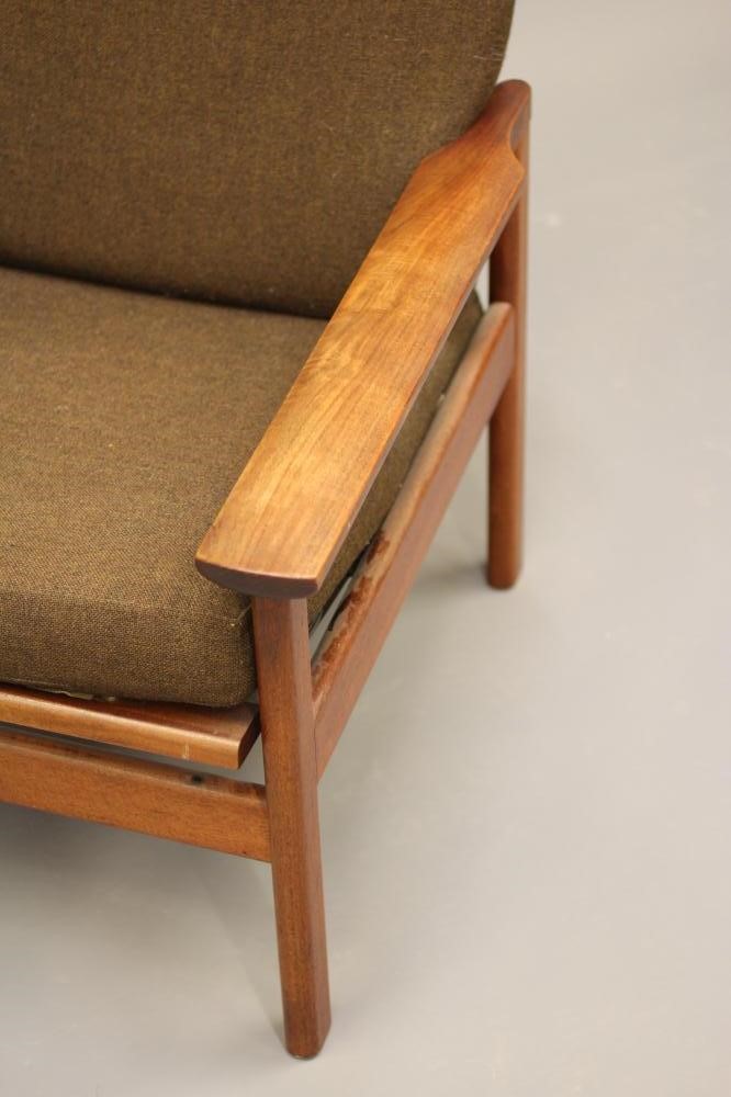 A RETRO TEAK FRAMED LOUNGE CHAIR with loose cushions in brown tweed Image
